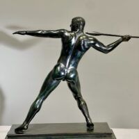 Alt text: Bronze sculpture of man with a spear