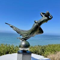 Alt text: Bronze sculpture of a floating woman