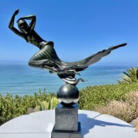 Alt text: Bronze sculpture of a floating woman