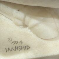 Alt text: Marble sculpture, signature detail