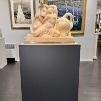 Alt text: Marble sculpture of a woman and a bull with bronze horns