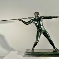 Alt text: Bronze sculpture of man with a spear