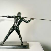 Alt text: Bronze sculpture of man with a spear