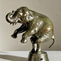 Alt text: Bronze sculpture of a circus elephant