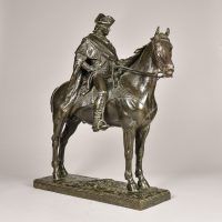 Alt text: Bronze sculpture of George Washington sitting atop his horse, angled view