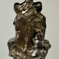 Alt text: Bronze sculpture of a nude woman sitting and reclining
