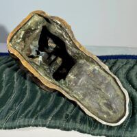 Alt text: Bronze sculpture, underside