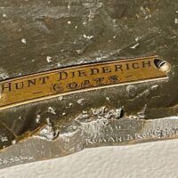 Alt text: Bronze sculpture, label detail