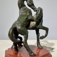 Alt text: Bronze sculpture of two stallions fighting