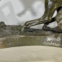 Alt text: Detail of cowboy sculpture, signed on base © 1922 / J. CLINTON SHEPHERD