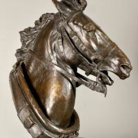 Alt text: Bronze sculpture of a horse head