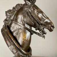 Alt text: Bronze sculpture of a horse head