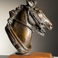 Alt text: Bronze sculpture of a horse head