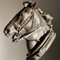 Alt text: Bronze sculpture of a horse head