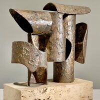 Alt text: Abstract steel and bronze sculpture