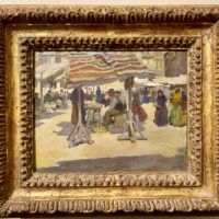 Alt text: Painting of an outdoor market, framed