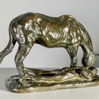 Alt text: Bronze sculpture of a horse and man drinking water