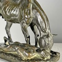 Alt text: Bronze sculpture of a horse and man drinking water