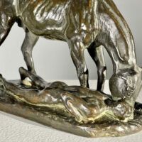 Alt text: Bronze sculpture of a horse and man drinking water