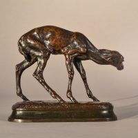 Alt text:Bronze sculpture of a scared fawn, side view