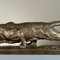 Alt text: Bronze sculpture of a prowling mountain lion