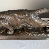 Alt text: Bronze sculpture of a prowling mountain lion
