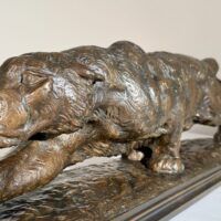 Alt text: Bronze sculpture of a prowling mountain lion