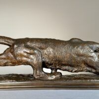 Alt text: Bronze sculpture of a prowling mountain lion