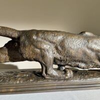 Alt text: Bronze sculpture of a prowling mountain lion