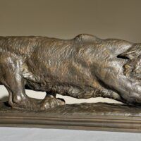 Alt text: Bronze sculpture of a prowling mountain lion