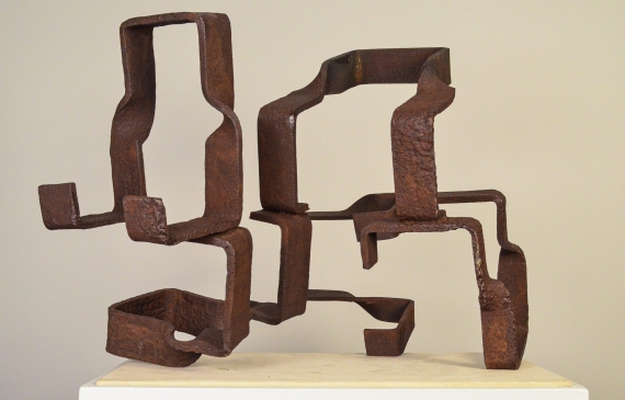 Alt text: Abstract steel sculptures resembling two figures side by side, frontal view