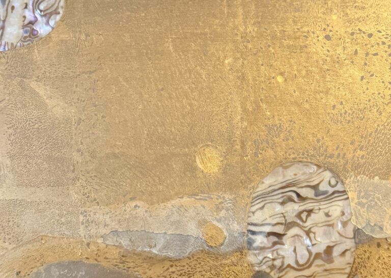 Alt text: Mixed media artwork with gold, detail