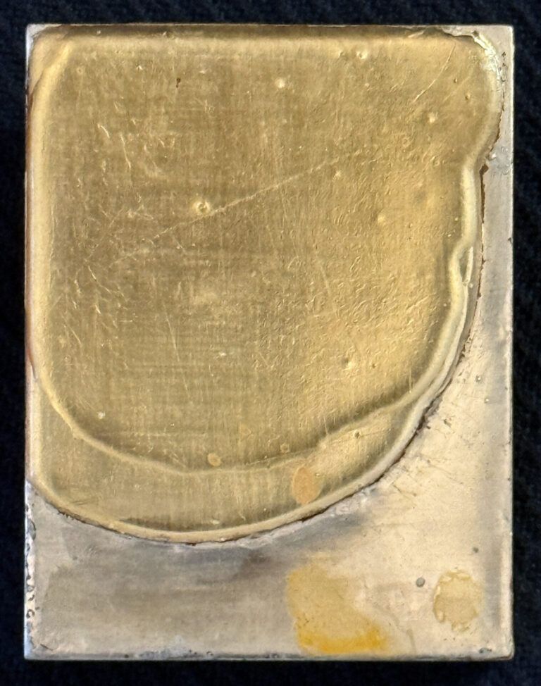 Alt text: Mixed media artwork with gold and silver