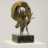 Alt text: Abstract bronze sculpture with rounded top fixed to a marble base, side view