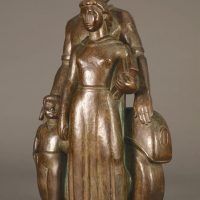 Alt text: Bronze sculpture of a family with father, mother, and child, left facing view
