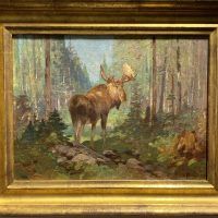 Alt text: Oil painting of a moose in a forest, looking back out at the viewer, with frame