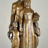 Alt text: Bronze sculpture of a standing family