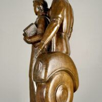 Alt text: Bronze sculpture of a standing family