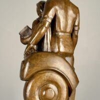 Alt text: Bronze sculpture of a standing family