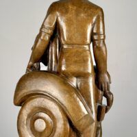 Alt text: Bronze sculpture of a standing family