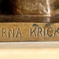 Alt text: Bronze sculpture signature detail