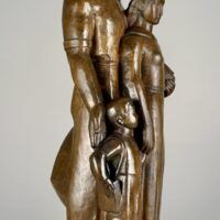 Alt text: Bronze sculpture of a standing family