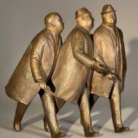 Alt text: Bronze sculpture of three businessmen in trench coats walking together, right facing view