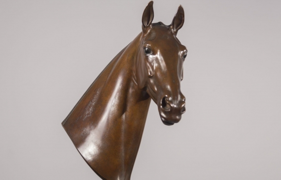 Alt text: Bronze bust of a Cherokee horse mounted on a marble base, right facing view
