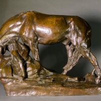 Alt text: Bronze sculpture of a horse bending down alongside a girl sitting near to the ground, peering over a cliff