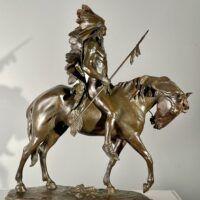 Alt text: Bronze sculpture of a Native American man on a horse