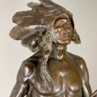 Alt text: Bronze sculpture of a Native American man