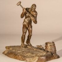 Alt text: Bronze sculpture of a railroad worker