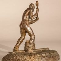 Alt text: Bronze sculpture of a railroad worker