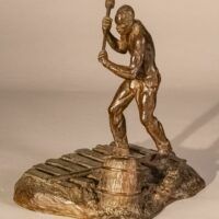 Alt text: Bronze sculpture of a railroad worker